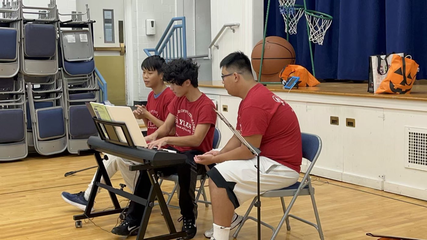 Volunteers performing keyboard and mallet percussion for students at Pillar Elementary School