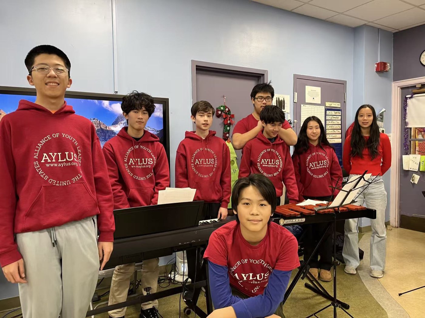 Volunteers performing keyboard and mallet percussion for students at Pillar Elementary School